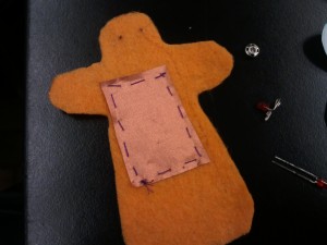 conductive fabric sewn onto doll